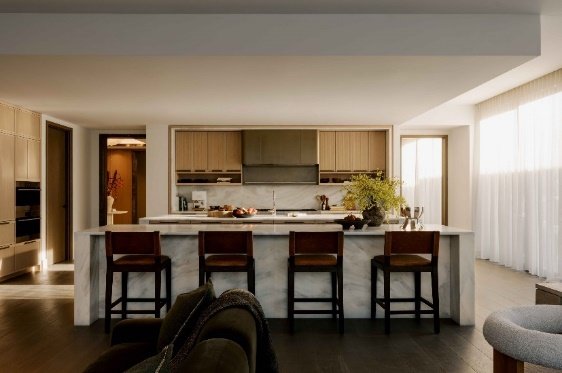 A kitchen with a bar and chairs

AI-generated content may be incorrect.